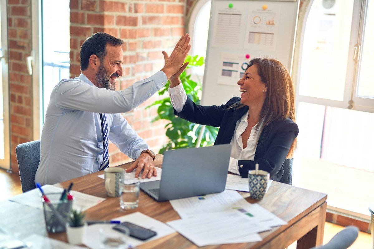 Consultant and client agreeing on an AI automation project